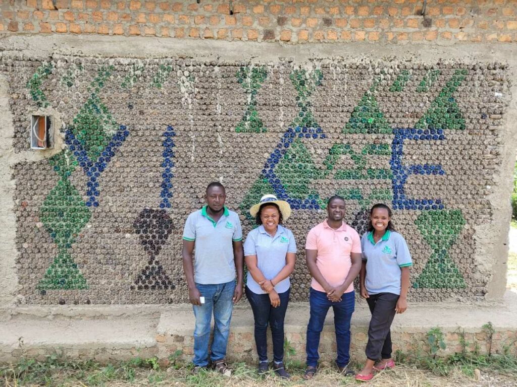 4 YICE team members in front of the newly built Regenerative Learning Center in Kassanda destrict, Uganda