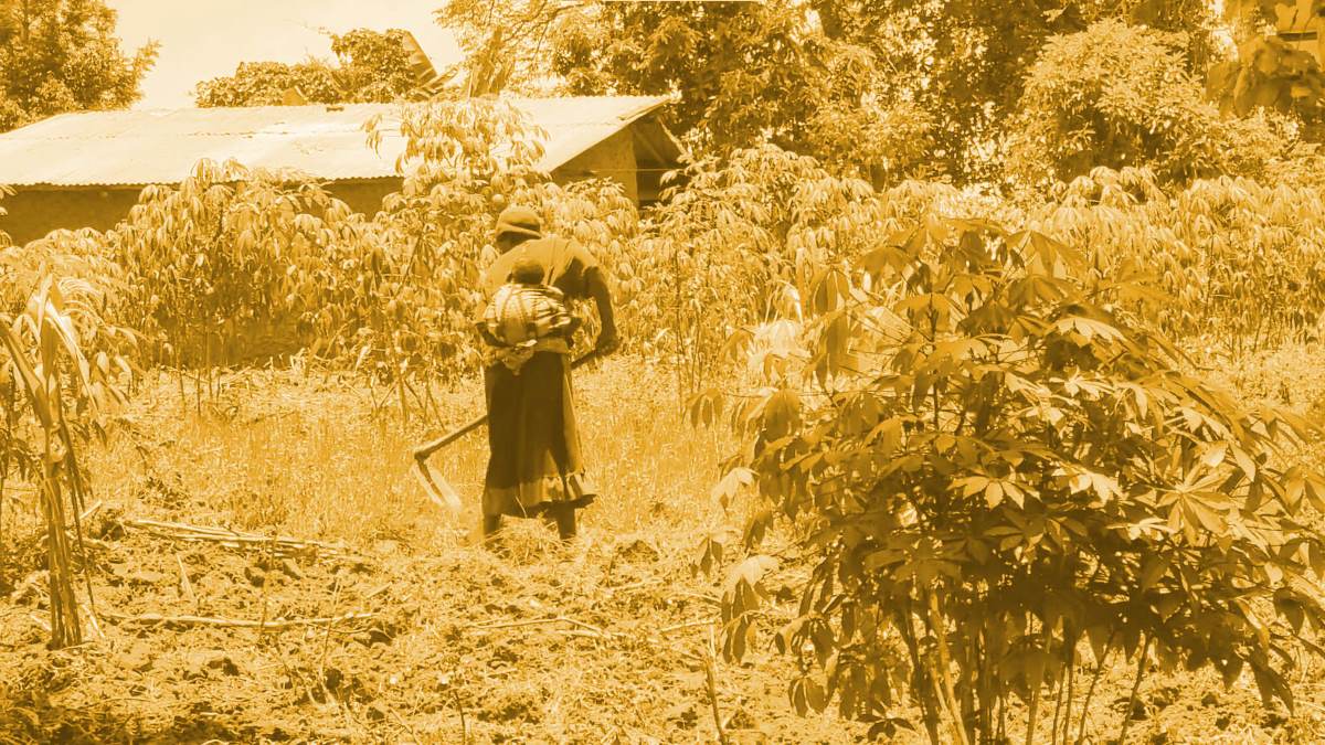 Refugee farmer with baby in Uganda